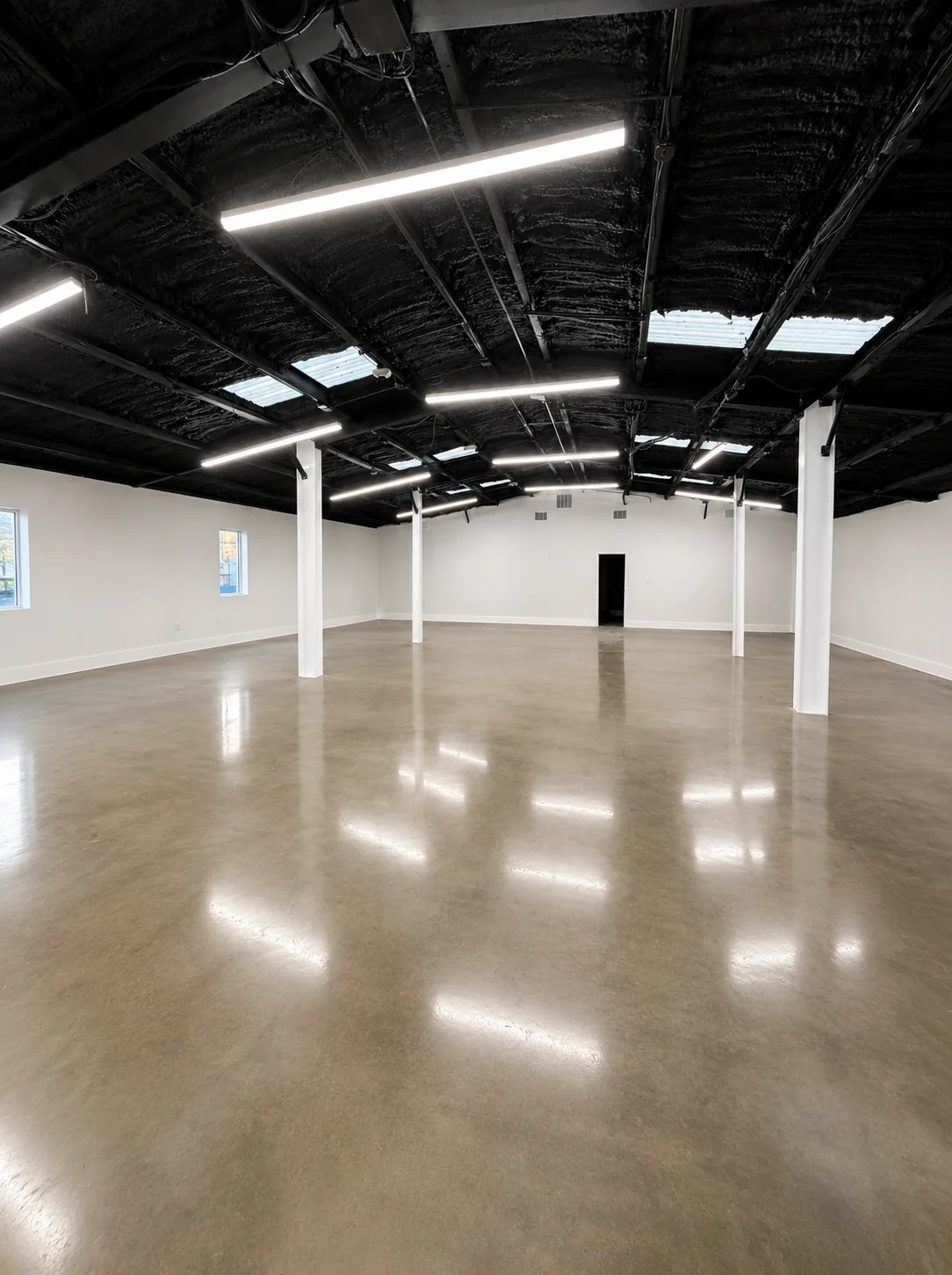 LAYD Spaces Bishop Arts open floor plan with polished concrete floors